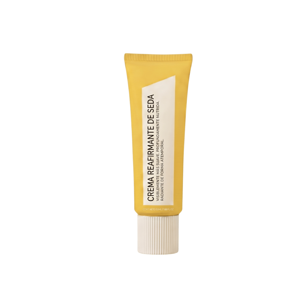 Crema Reafirmante de Seda en tubo amarillo, ideal para una piel más firme y suave.